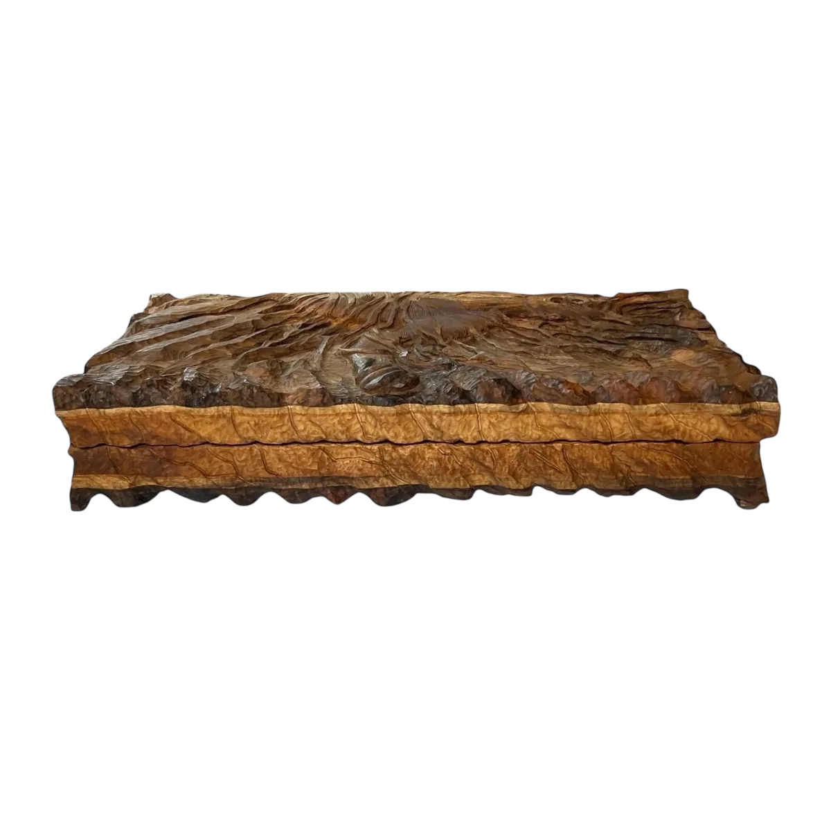 Side view of a closed carved backgammon board, with textured sides and a wavy bottom edge