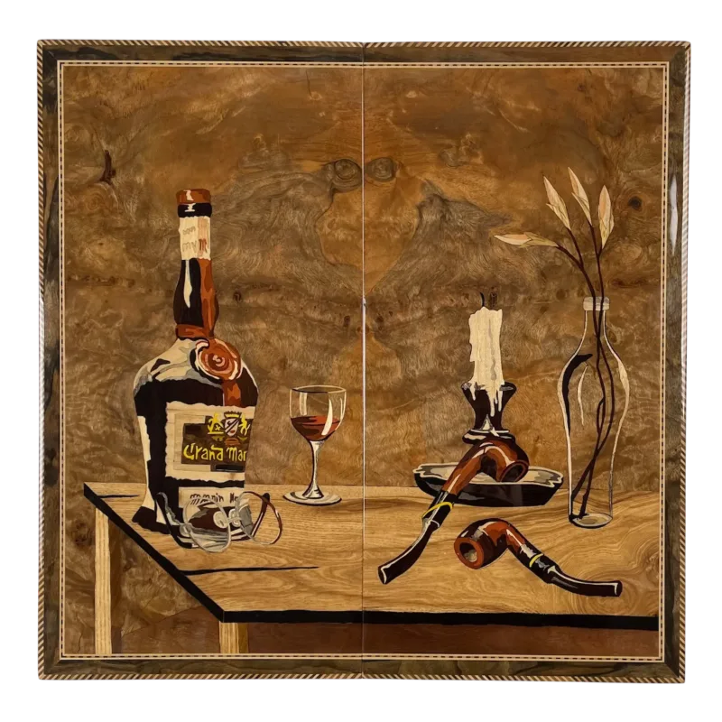 Wooden inlay panel with bottle, glass, candle, pipe and vase figures on the closed backgammon board