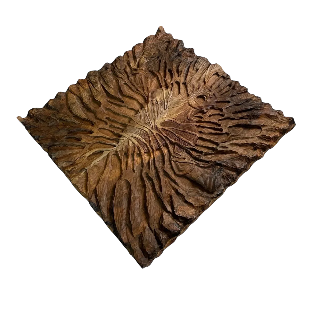 Angled top view of a closed carved backgammon board, with carved lines radiating from the center