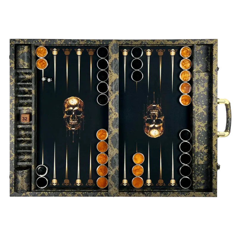 Open backgammon set: snakeskin-pattern edges, golden skull figures on a black background, orange and black checkers